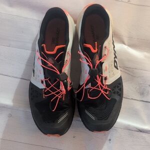 Dynamic Women's Black and White Athletic Shoes with Orange Accents